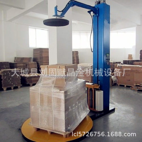 青岛食品裹包缠绕机 圆盘打托盘设备 PE拉伸膜缠绕膜包装机出口