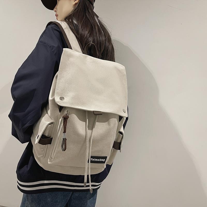 帆布双肩包男高中大学生书包女简约休闲抽绳翻盖背包15.6寸电脑包