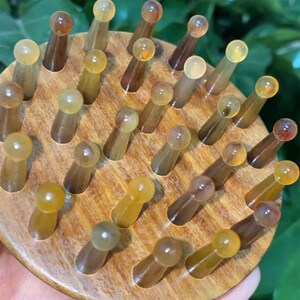紫光檀镶嵌羊角28钉指环王梳子按摩梳天然头部经络头疗身体刮肚子