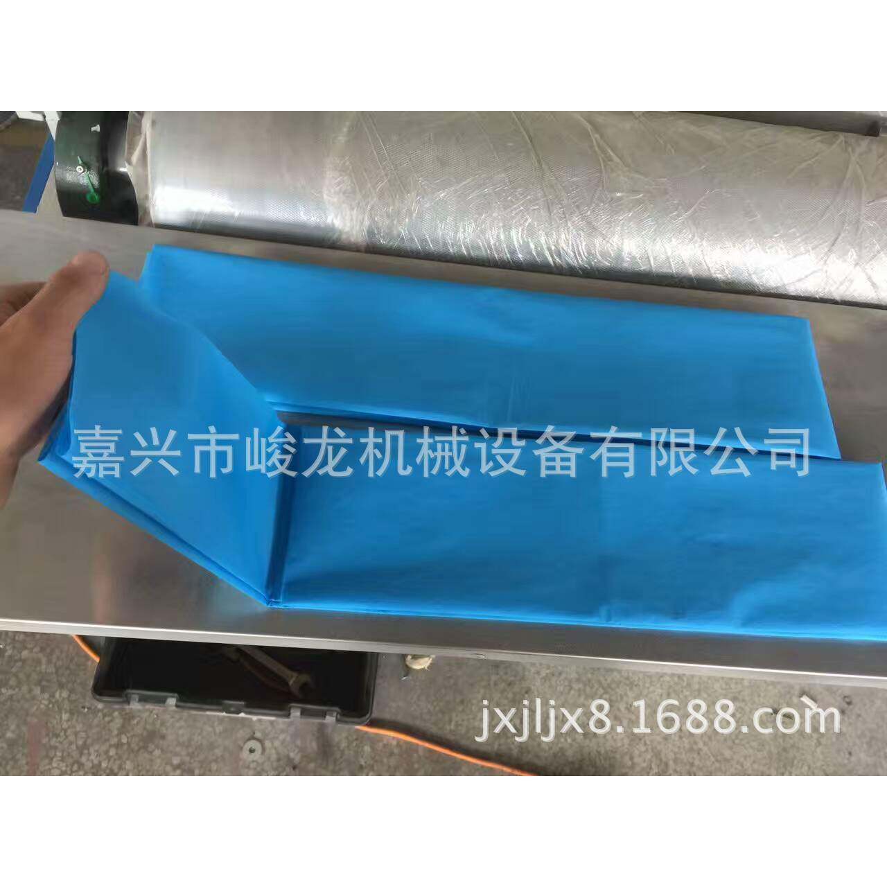 1厂家直销一次性床单机器设备美容太阳孔床单折叠机无纺布床单
