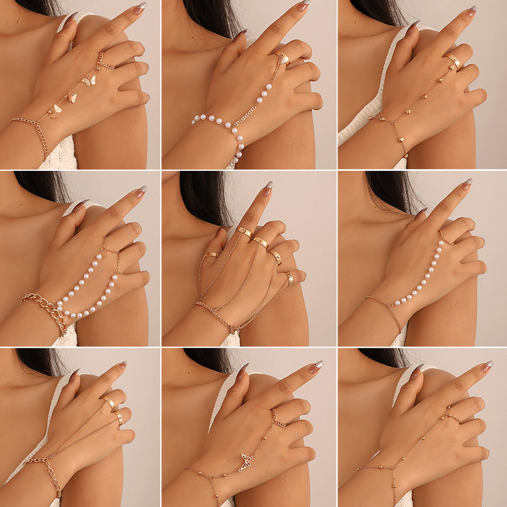 欧美跨境链条指环手链蝴蝶爱心珍珠连指戒指嘻哈夸张一体式手饰