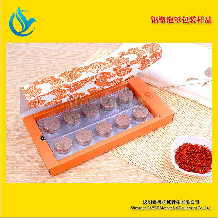 广东足浴泡片雷粤塑/泡足片铝塑罩包装机 泡艾灸艾脚草片铝包装机