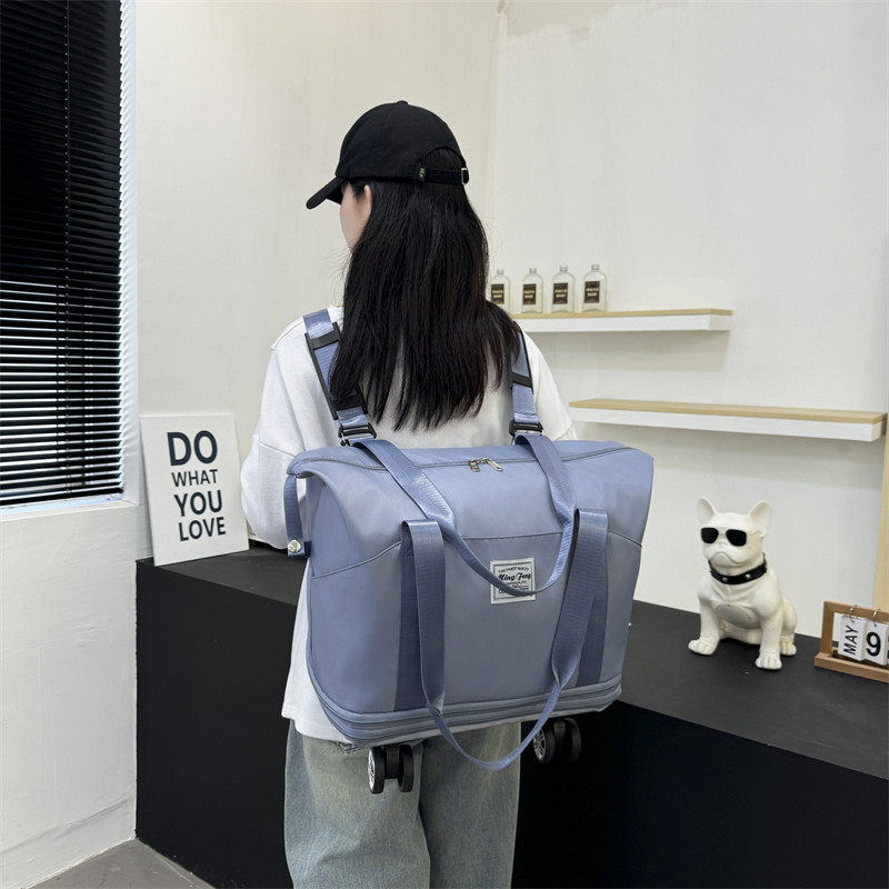 新款大容量带轮旅行包免