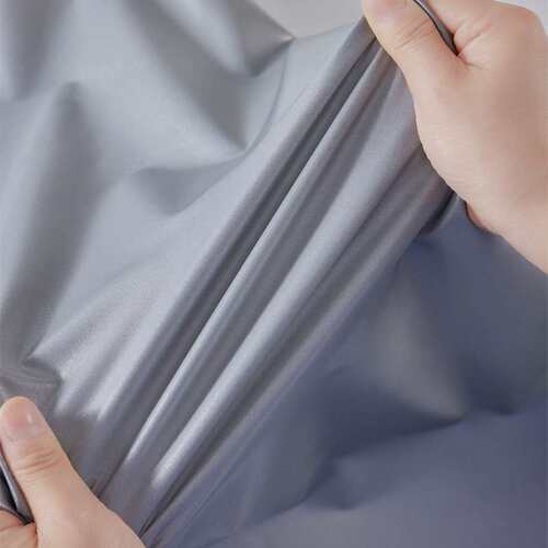 薄型亮银单面反光布弹力反光面料涤氨弹性布料服装面料厂家
