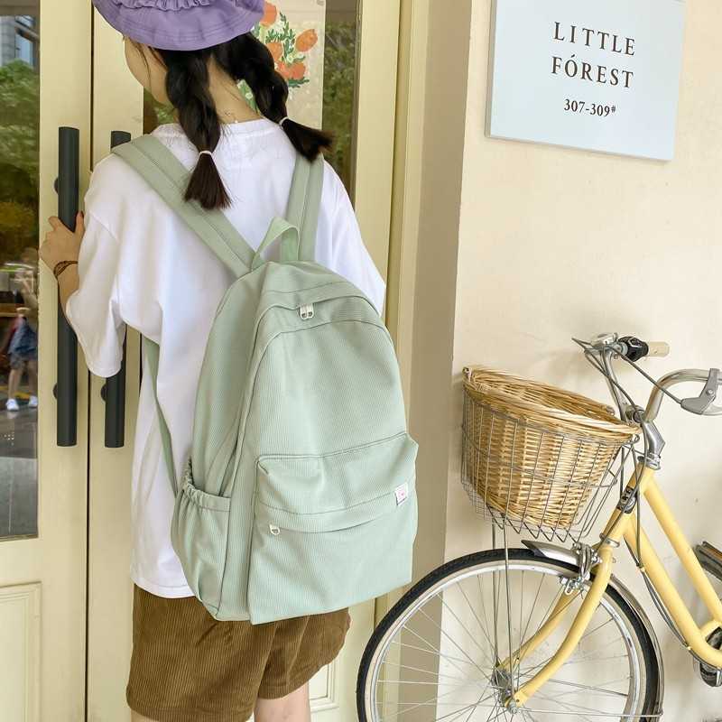 甜美软妹纯色大容量学生书包2023秋季新款大学生ins双肩包