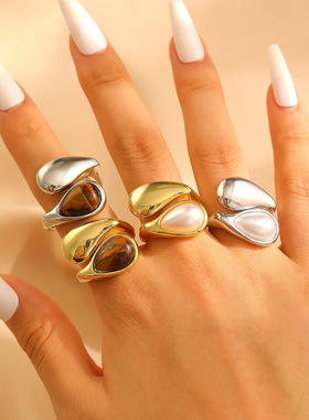 A stylish pearl tiger eye ring with a drop-shaped opening