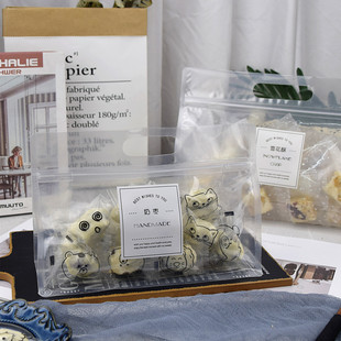 网红杏仁奶枣雪花酥牛轧糖纽扣曲奇饼干奶乐渣包装袋透明手提袋子