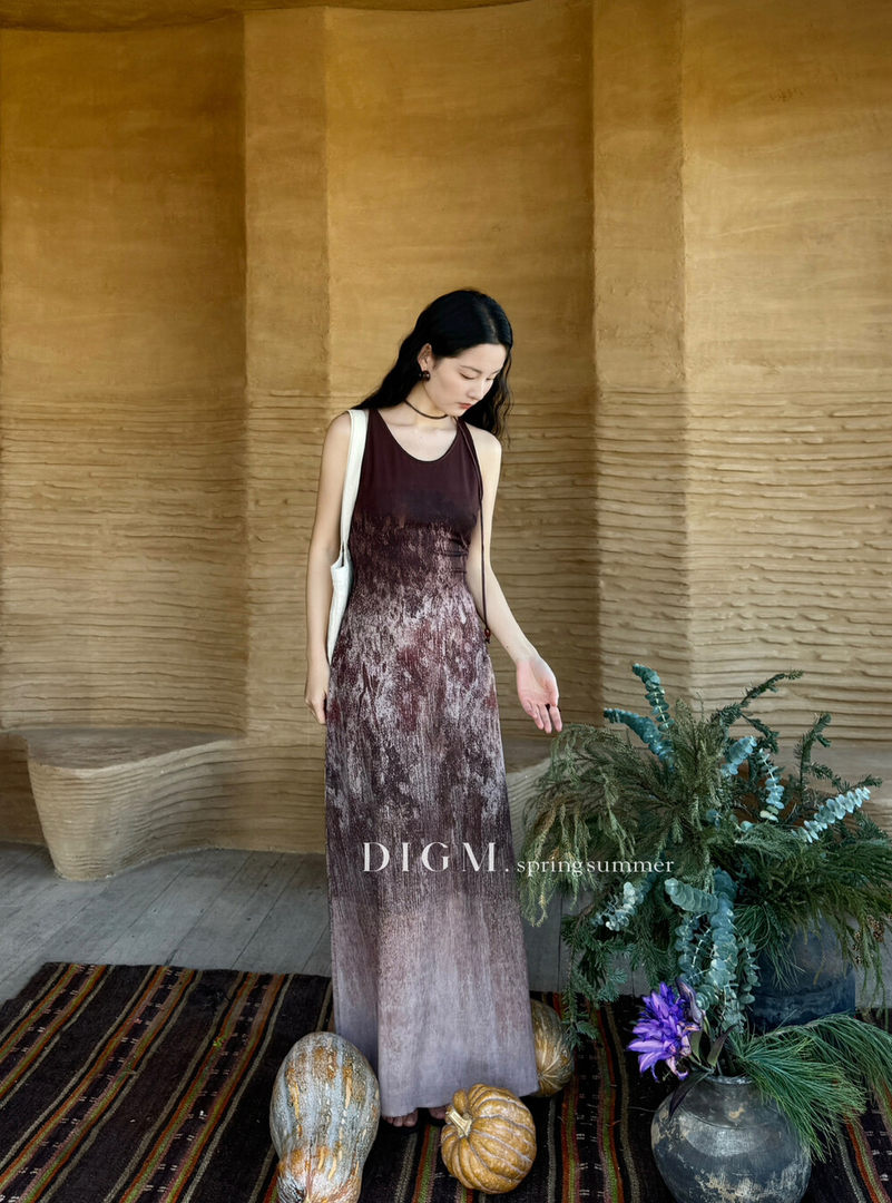 Woman wearing a sleeveless gradient maxi dress