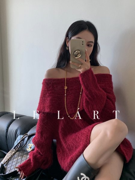 Woman wearing a burgundy off-shoulder fuzzy knit sweater dress