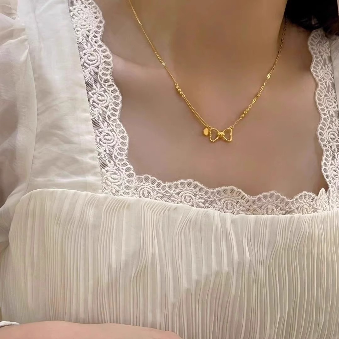 新款黄金色蝴蝶结项链女轻奢高级感小众设计感转运珠锁骨链送女友