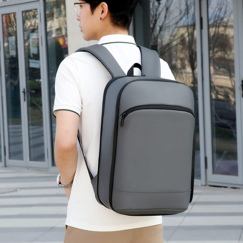 超薄双肩包男女士纯色简约商务背包15.6寸电脑包时尚轻便防水书包