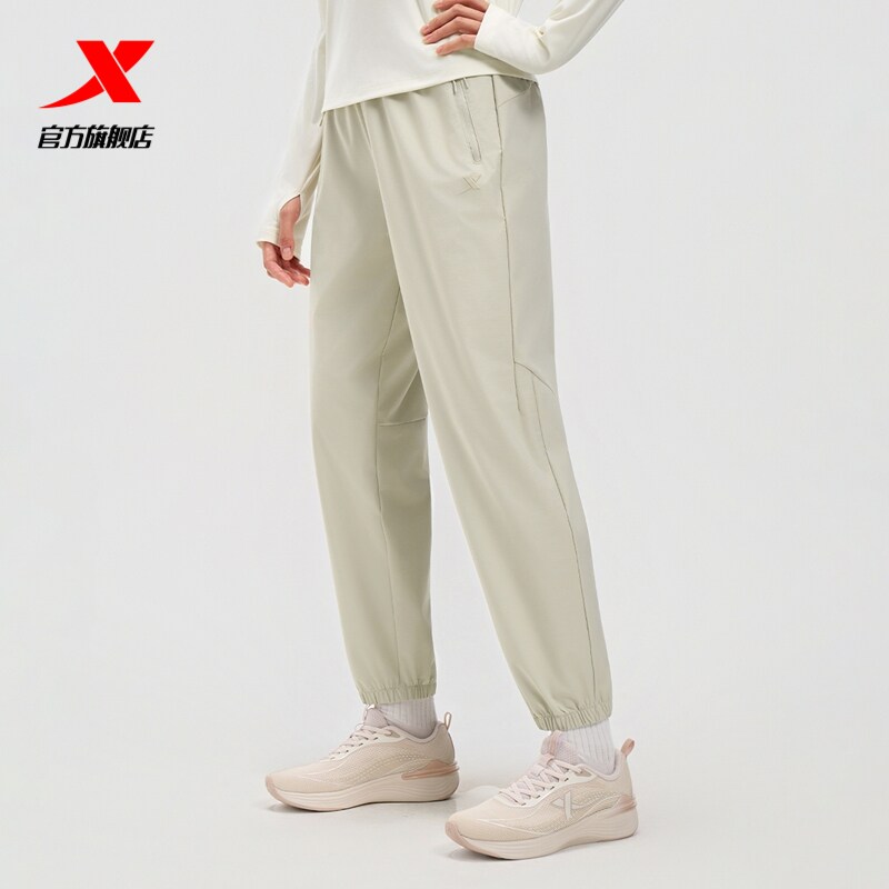 特步女裤梭织九分裤户外裤子2025秋季新款防泼水冰丝速干收口束脚