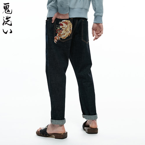 泥棒蓝五福火狮绣花红布边牛仔裤