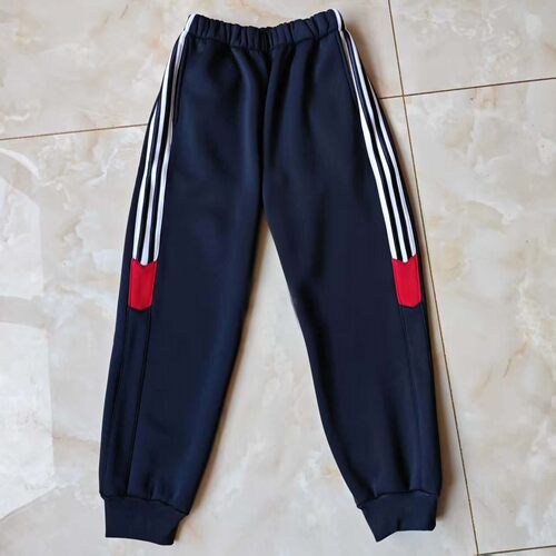 订做咸阳市古渡中心小学深蓝校服运动裤子束口侧边三道白杠拼红条