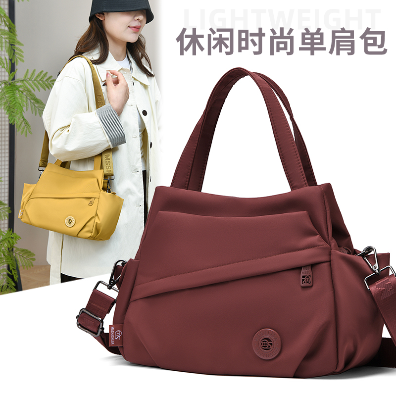 大容量牛津布帆布包女2025新款单肩斜挎包简约百搭通勤妈妈手提包