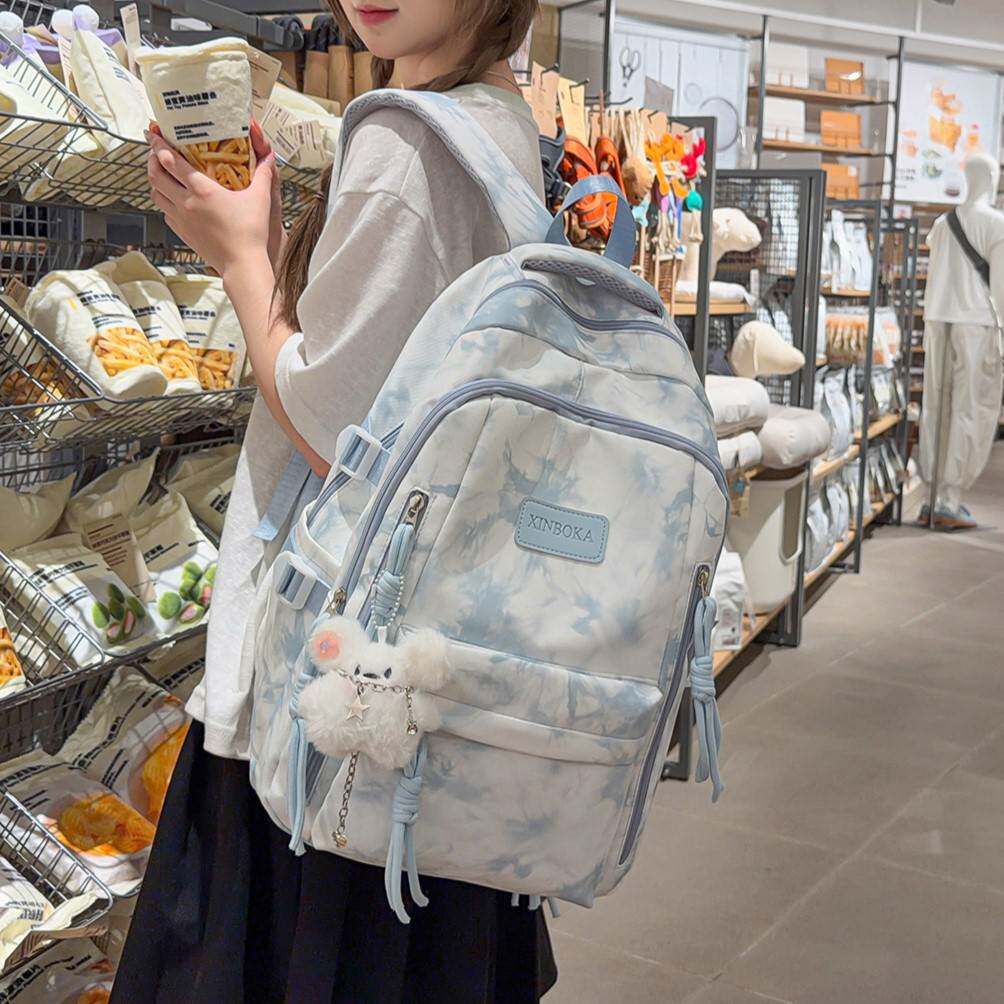 商场品牌新款扎染书包女ins小众初高中高颜值小学生护脊减负中学