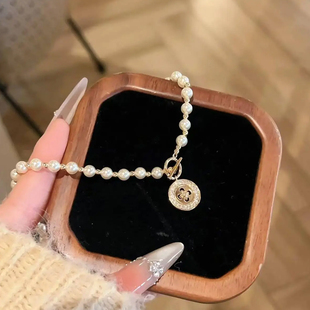 星语纽扣施家珍珠项链女款2025新款配饰毛衣链秋冬轻奢高级感颈链