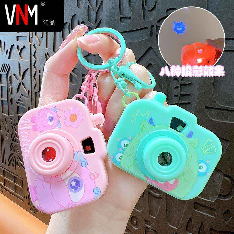 创意卡通小怪兽三眼怪迷你仿真发光投影相机钥匙扣学生玩具小礼品