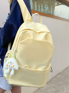 纯色书包女大学生简约高颜值奶黄色双肩包日系初中高中生百搭背包