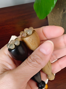 小红书  紫光檀眼部小莲蓬按摩梳绿檀木羊角珠眼部按摩朱雀三啄棒