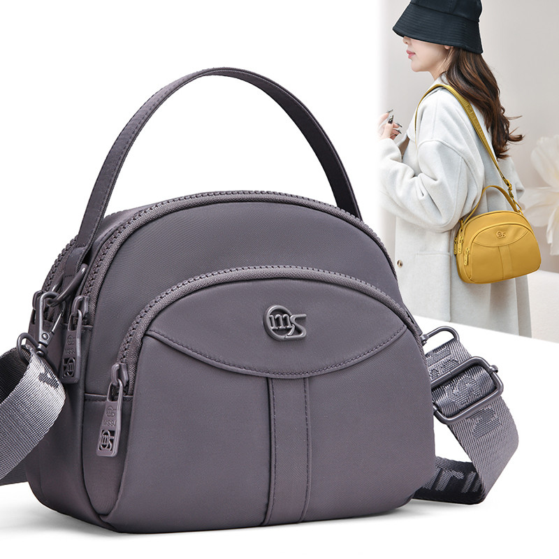 2026新款休闲简约风女士斜挎包多层轻便手提包大容量手机包零钱包