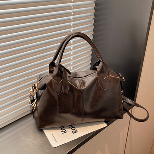 大容量手提包包女式2026新款复古高级感通勤枕头包精致单肩斜挎包