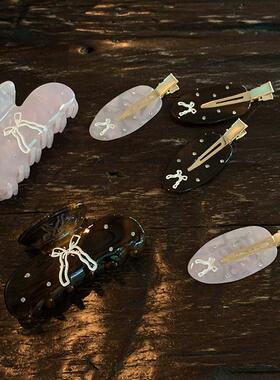 小众设计蝴蝶结抓夹女发量少中号 通透粉色盘发鲨鱼夹醋酸发饰