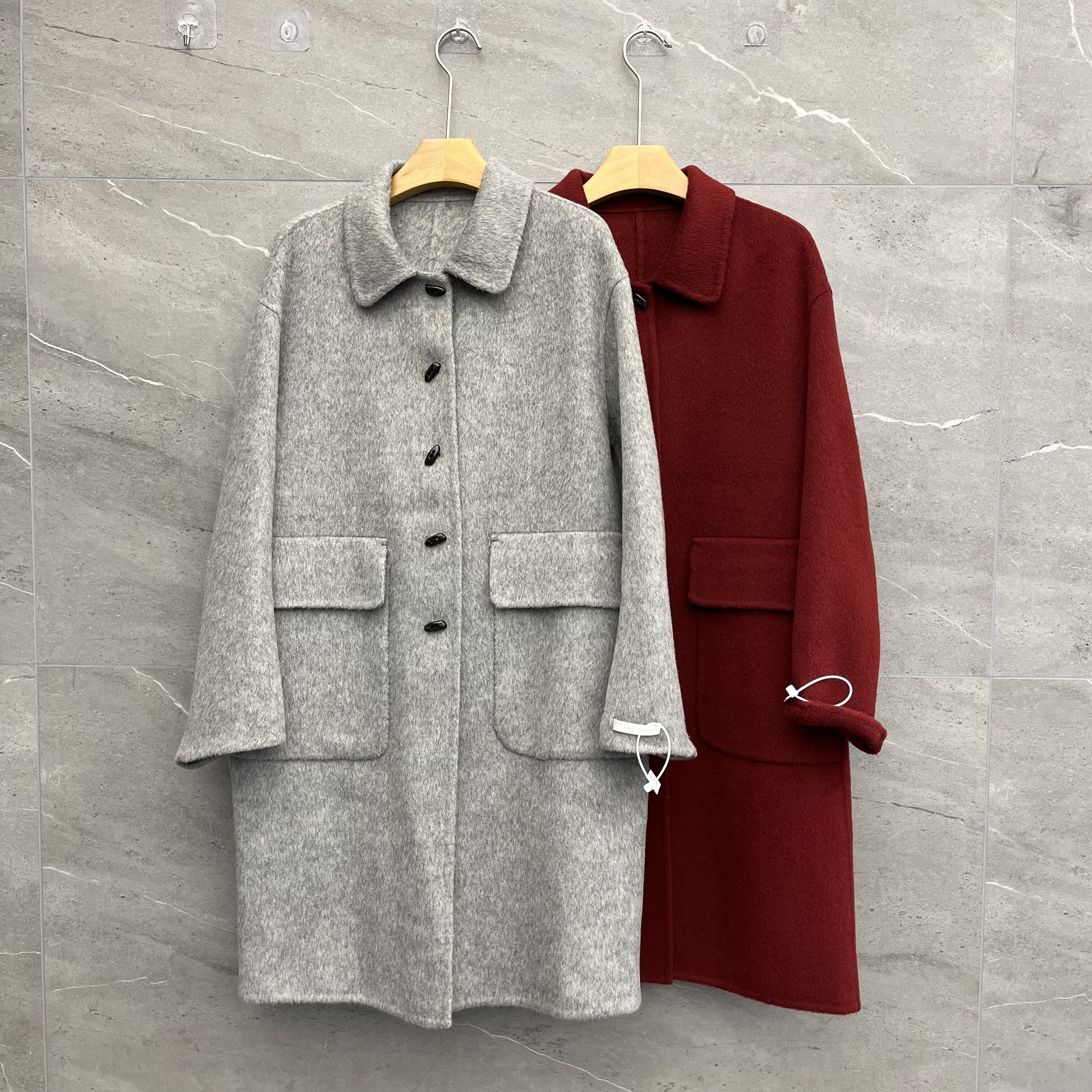 欧洲站2025冬季新款女士翻领大口袋牛角扣双面羊绒大衣时尚中长款