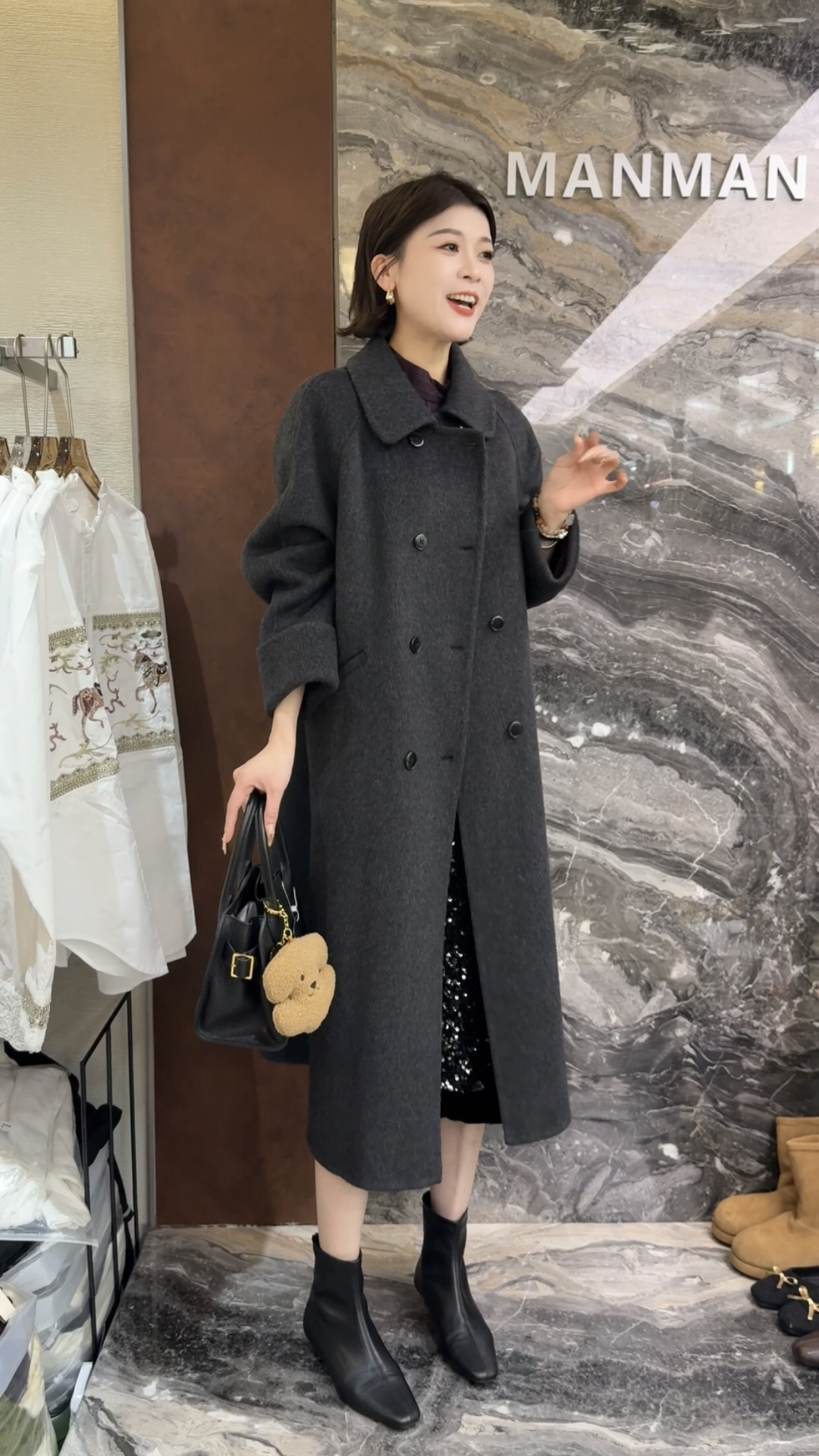 欧洲站2025冬季新款翻领双排扣设计简约休闲中长款净版羊绒外套女