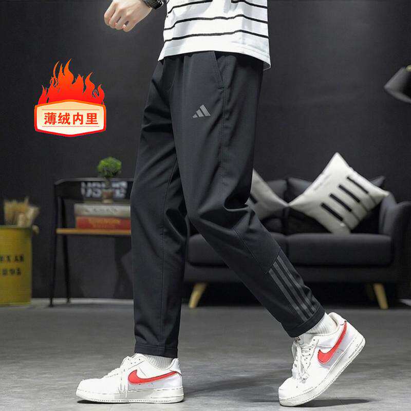 Adidas阿迪达斯加绒裤子男秋新款户外梭织运动裤小脚男士休闲长裤