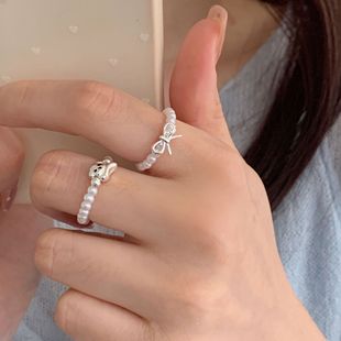 甜美仿珍珠串珠戒指女手作弹力可爱小狗蝴蝶结指环百搭叠戴食指戒