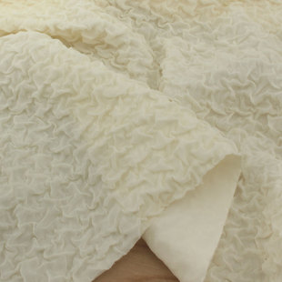 杏黄色立体弹力软垂感泡泡时装布料 礼服外套上衣裙子阔腿裤面料