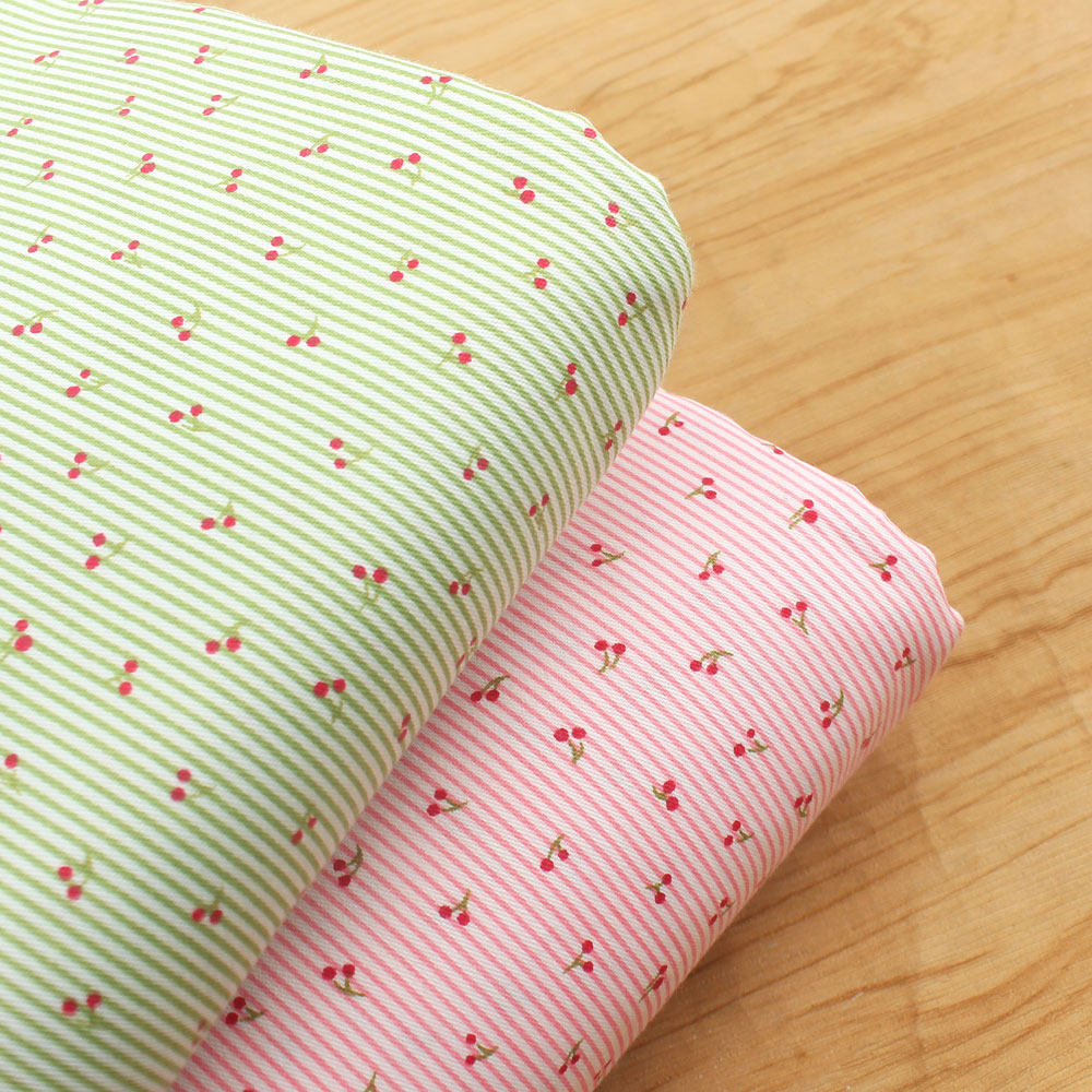 粉色浅绿细条纹樱桃纯棉布料