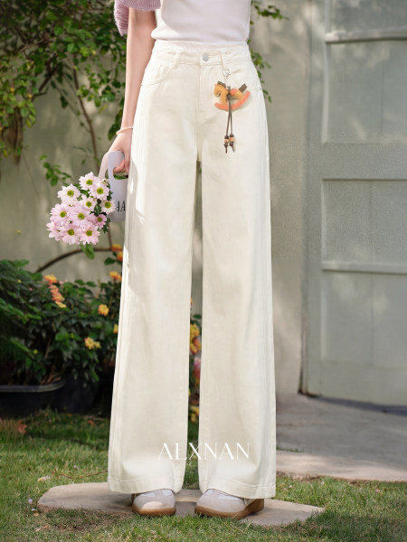 White high-waisted wide-leg pants worn by a model outdoors