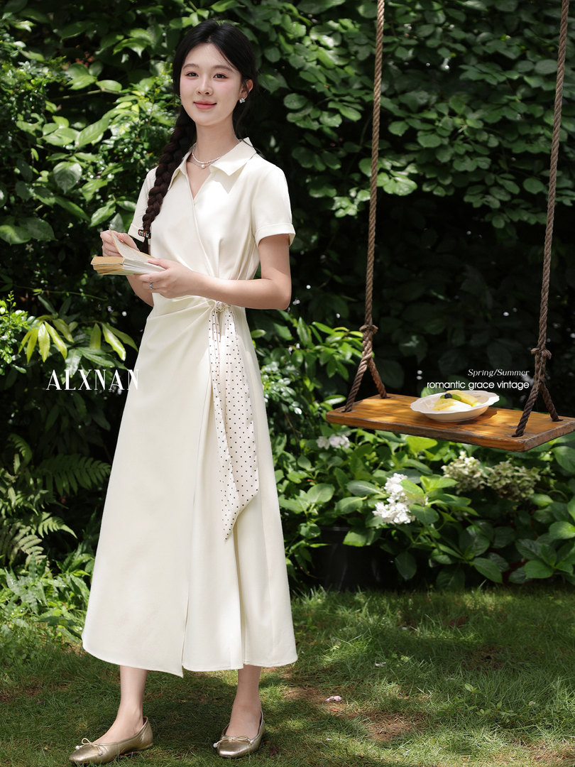 Model wearing a cream wrap midi dress outdoors
