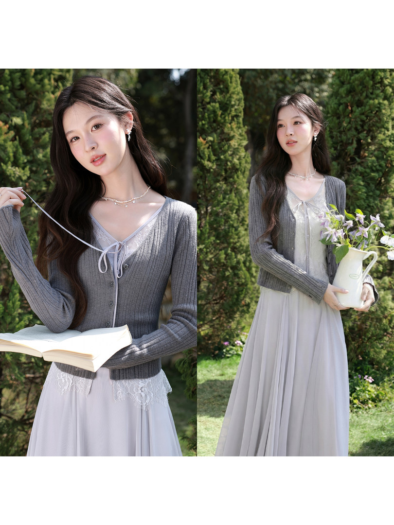 Woman wearing a gray cardigan over a light lace dress in a garden setting
