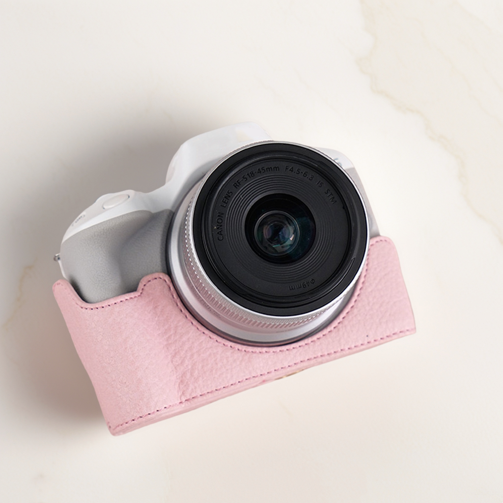 适用佳能R50保护套r100相机包r5底座R6半套R8壳r10皮套200D二代RP