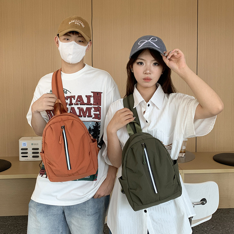 红鹮鸟2025时尚大学生双肩小背包休闲百搭轻便旅行胸包男女包
