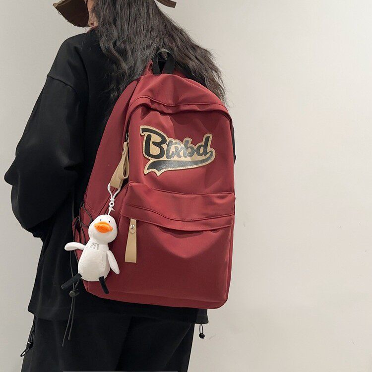 红鹮鸟书包防水超轻简约尼龙背包时尚韩版高中生初中生女学生包包
