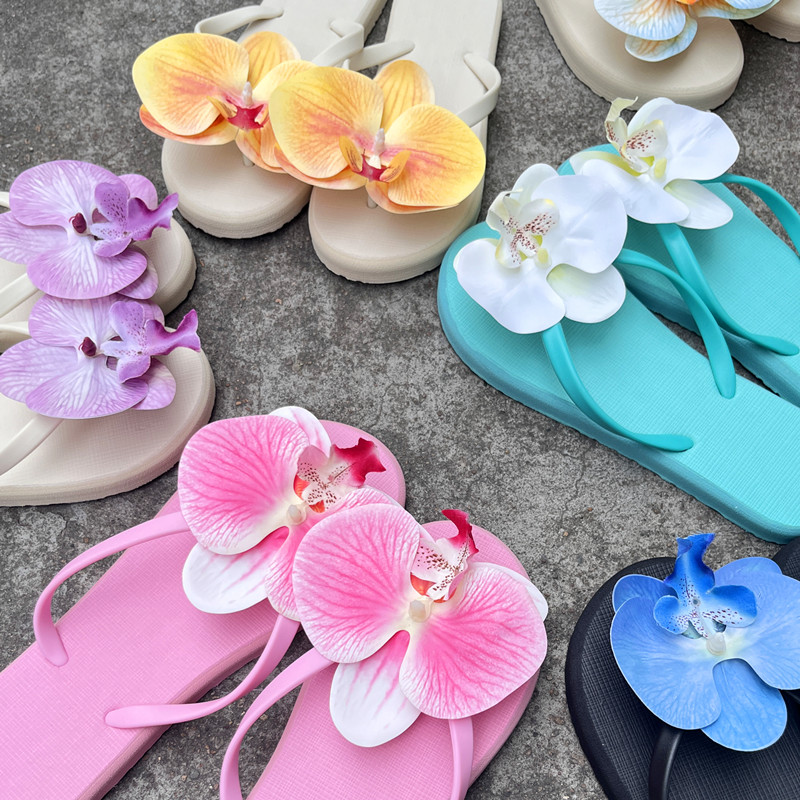 新款泰国蝴蝶兰花朵人字拖网红沙滩度假风小众设计平底海边拖鞋潮