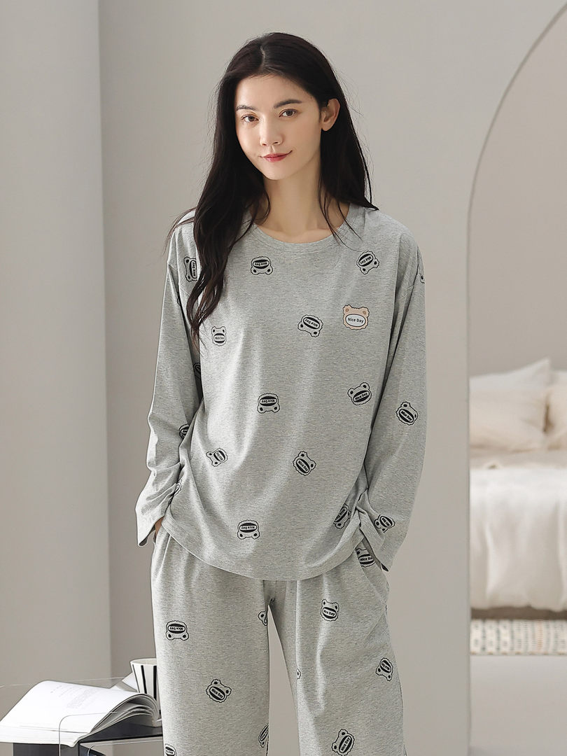 Gray loungewear pajama set with small cartoon print worn by a model