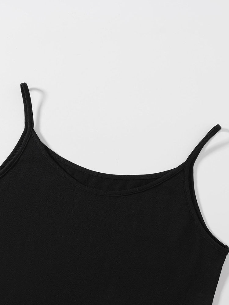 Black spaghetti strap tank top laid flat on a white background