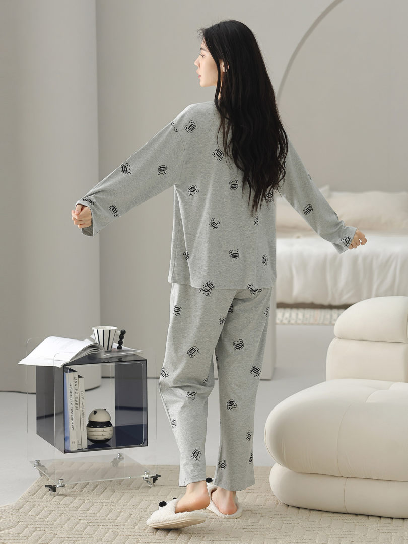 Gray patterned loungewear pajama set worn by a model indoors