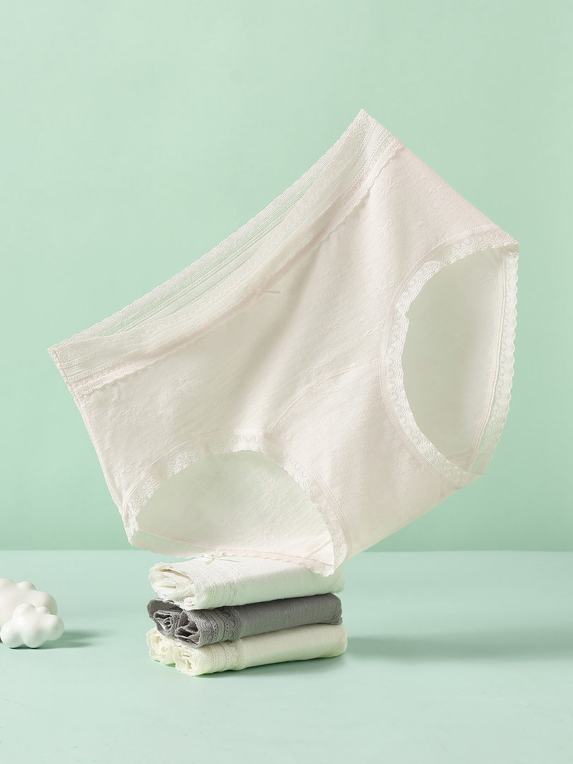 White women's briefs displayed on a plain background
