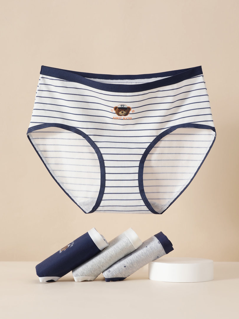 Striped men's underwear briefs with navy trim and bear graphic on a neutral background