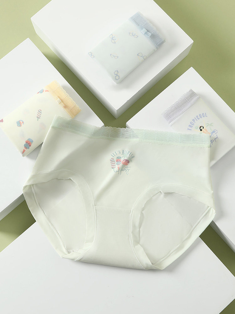 Light-colored women's underwear briefs displayed on boxes