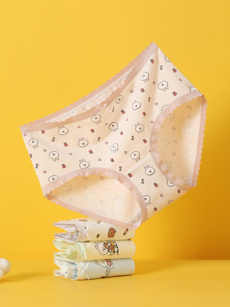 Pastel printed women's underwear briefs on a yellow background