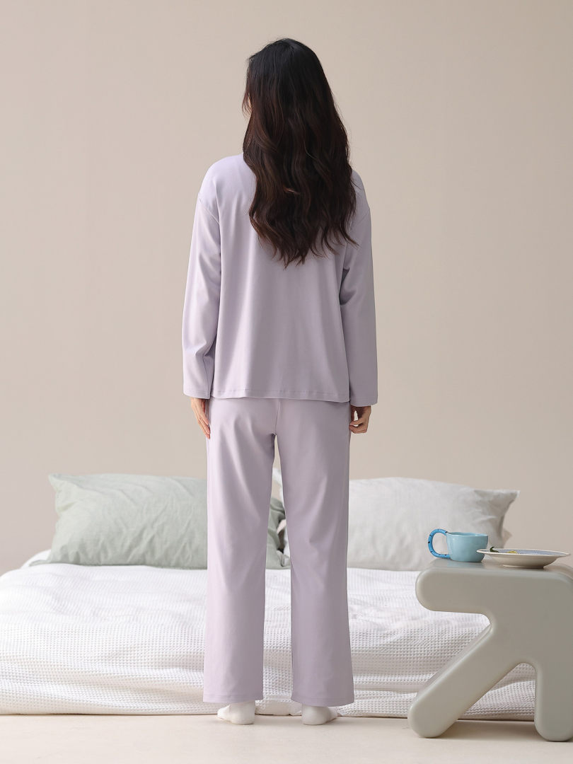 Woman modeling a light lavender loungewear pajama set