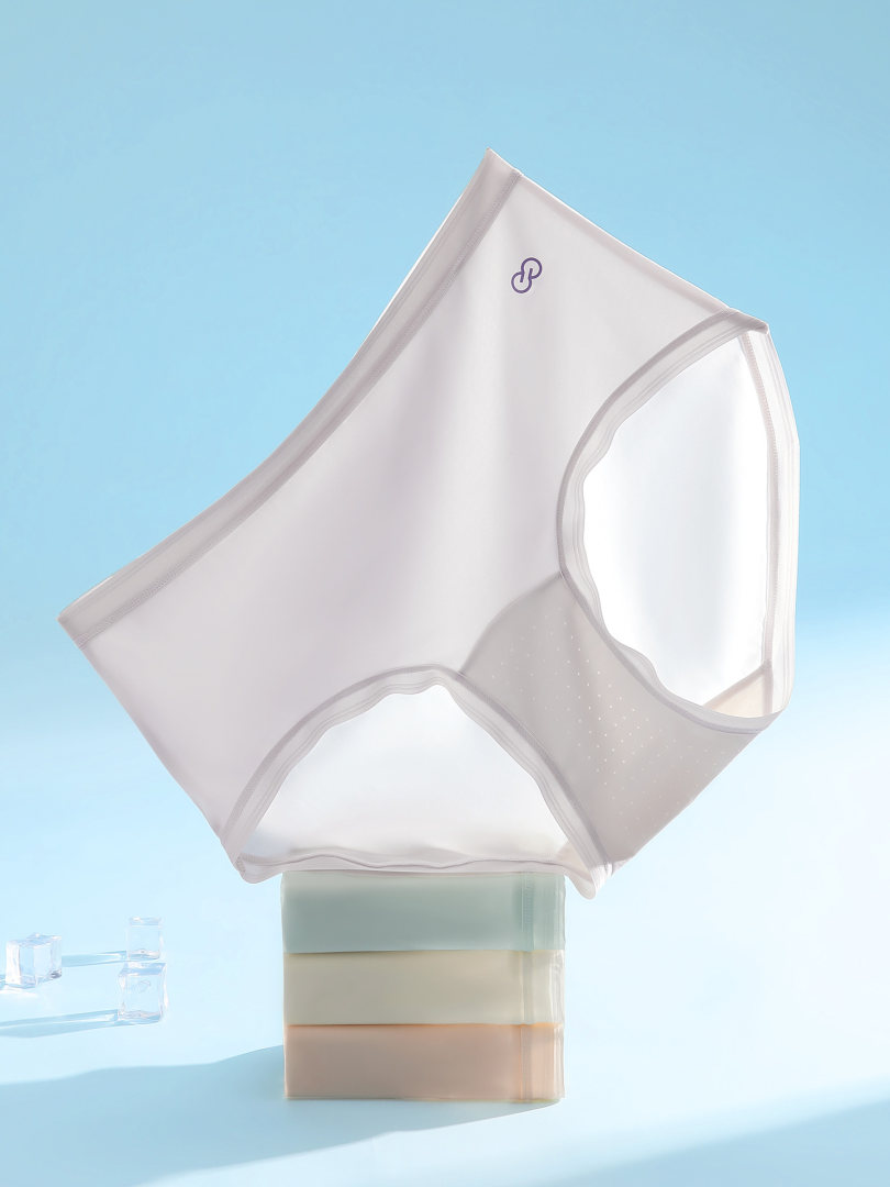 Lightweight seamless underwear briefs in white and beige tones on a blue background