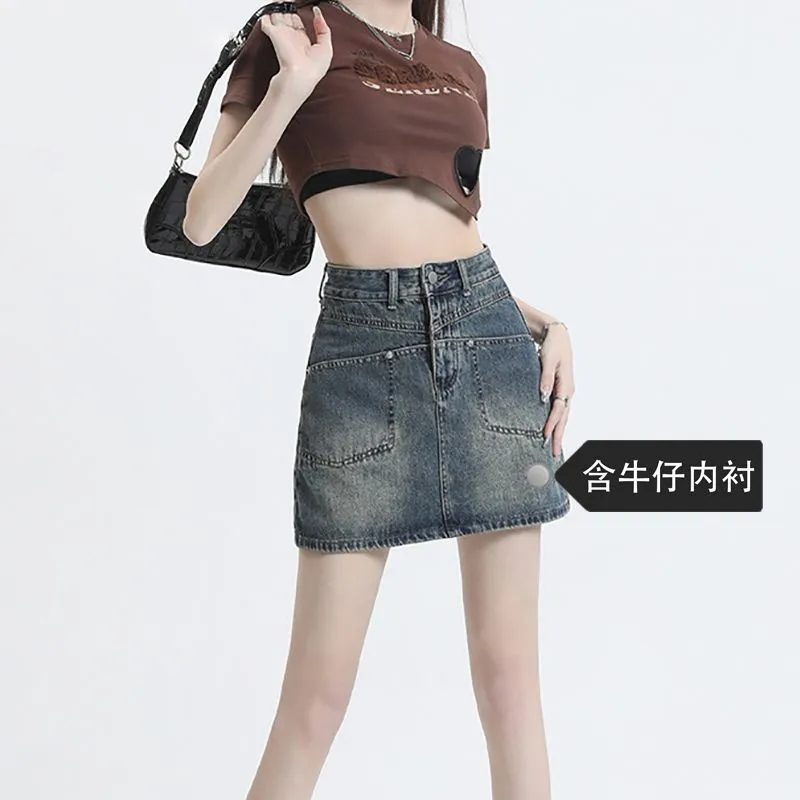 高腰牛仔短裙女2025年春夏新款显瘦设计感小个子包臀a字裙半身裙